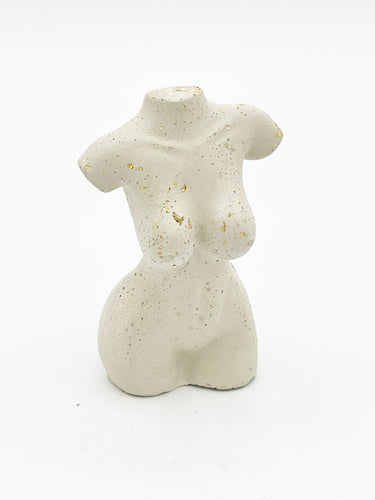Embellished female body statue