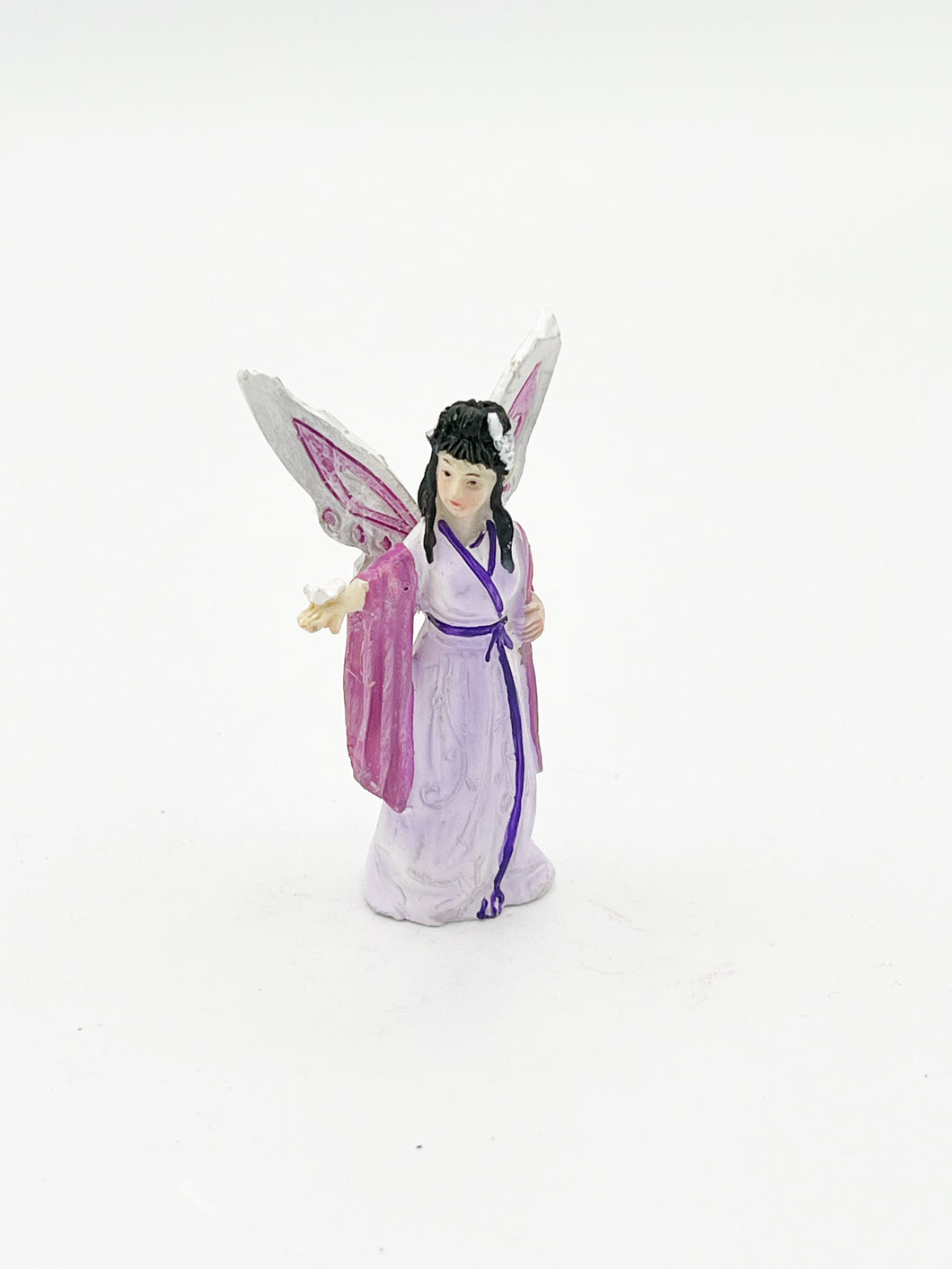 Asian fairy with butterfly on hand
