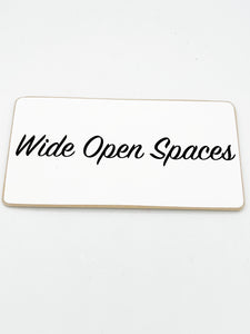 Wide open spaces sign
