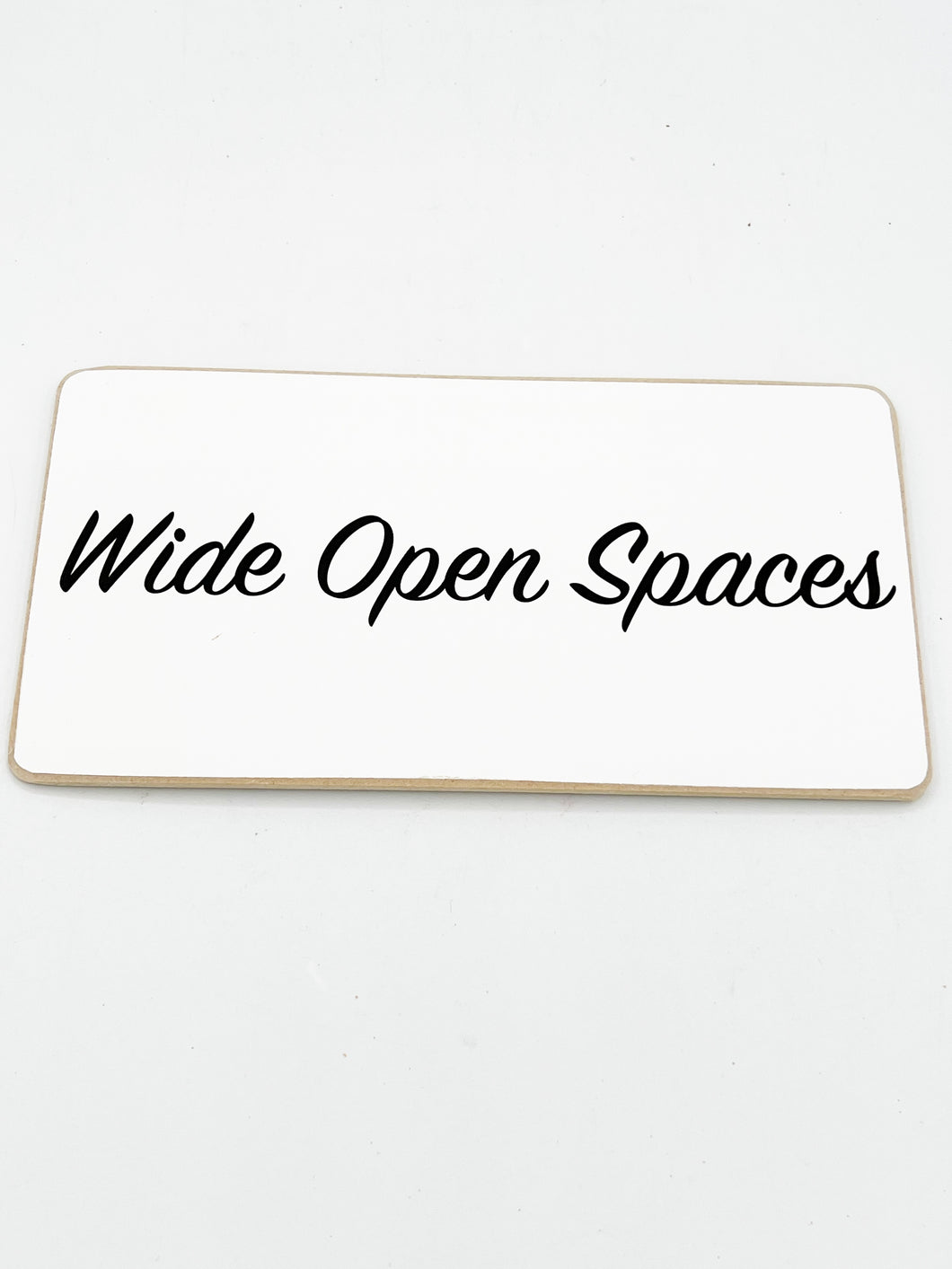 Wide open spaces sign