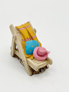 Beach chair with towel and hat