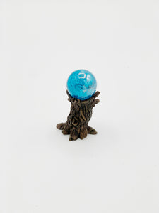 Gazing ball on tree stump