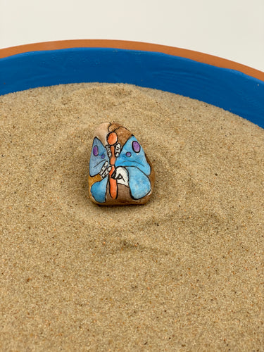 Hand holding butterfly